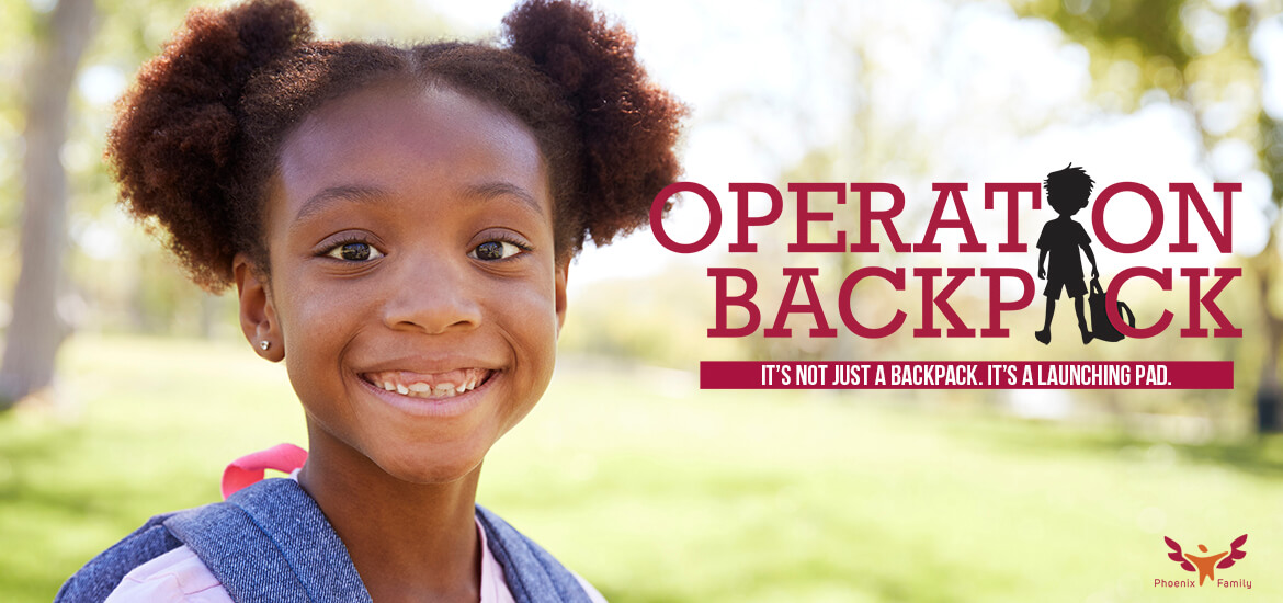 Smiling african american girl with backpack on her way to school. Words say Operation Backpack. It's not just a backpack. It's a launching pad.