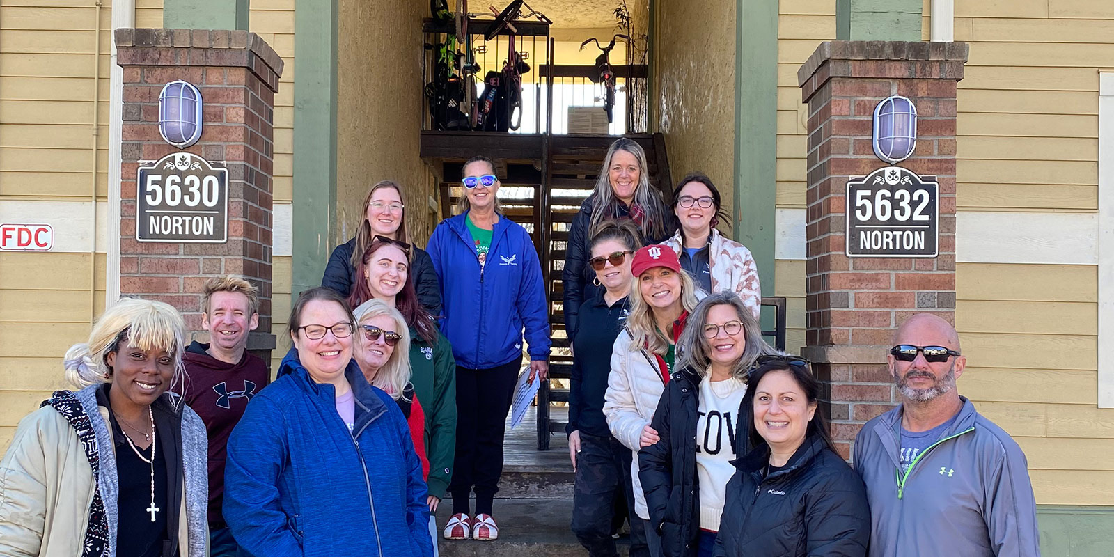 Phoenix Family volunteers outside one of the communities we serve