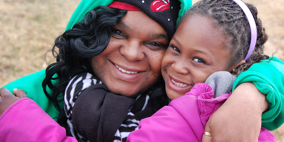 A mother and her child together in their apartment community supported by Phoenix Family