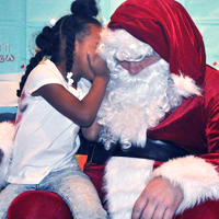 A Phoenix Family child meeting Santa