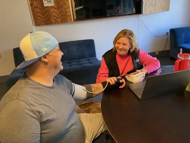 Older adults participating in a wellness activity at a Phoenix Family senior community.