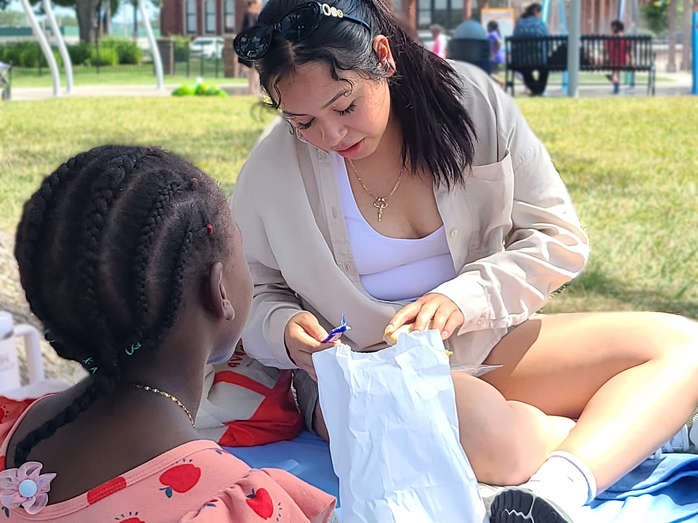 A volunteer sitting with a child.