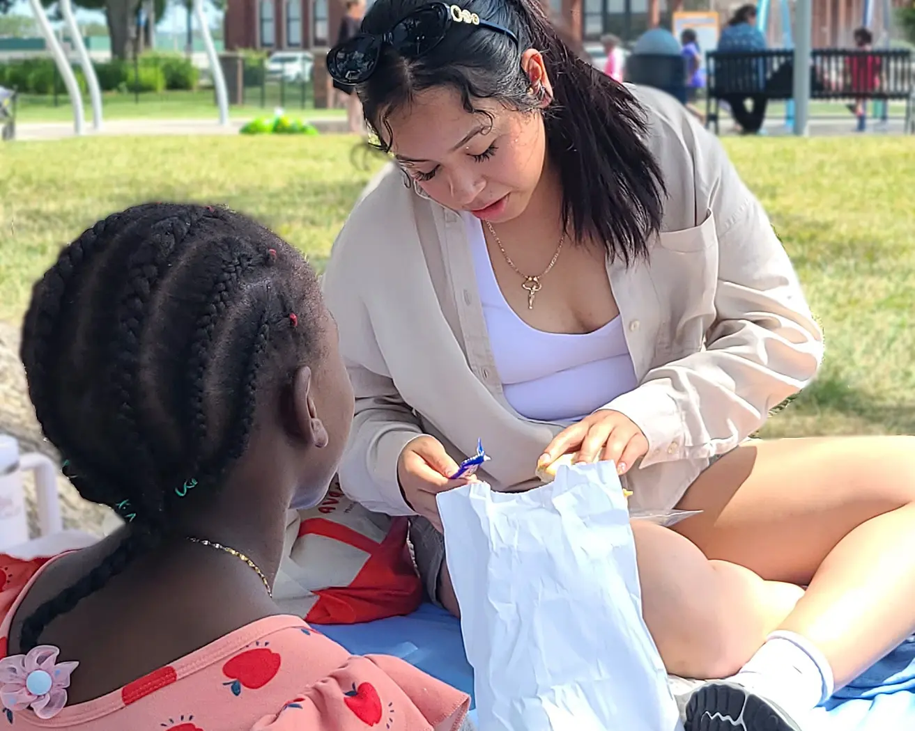A volunteer sitting with a child.